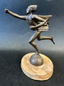 A car mascot in the form of a man running at speed, display base mounted, approx. 5 1/2" wide x 6"
