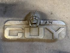 A Guy lorry radiator badge surmounted by a native American chief.