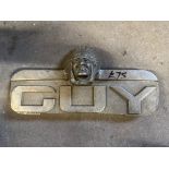 A Guy lorry radiator badge surmounted by a native American chief.