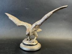 A car mascot in the form of an eagle/bird of prey with outstretched wings, very well detailed,