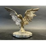 A car accessory mascot in the form of a bird of prey with outstretched wings, approx. 5 1/4" high.