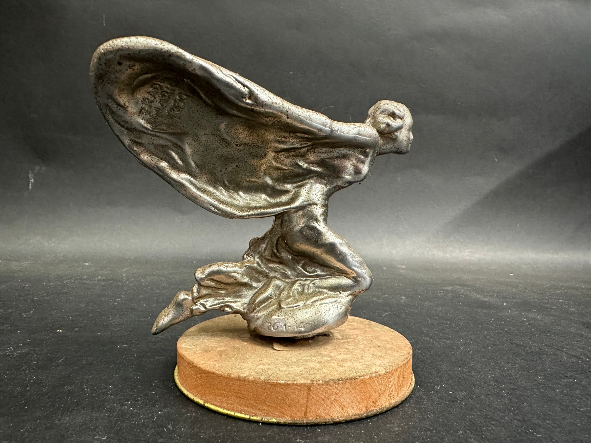 A Rolls-Royce kneeling lady car mascot inscribed 26.1.34 and signed C. Sykes, approx. 3 3/4" high