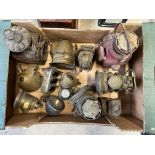 A good box of assorted early brass lamps, acetylene and electric including a Morris triple indicator