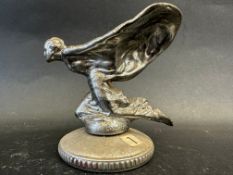 A Rolls-Royce kneeling lady car mascot, signed C. Sykes and dated 26.1.34, mounted on a radiator