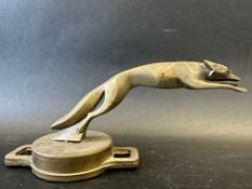 An Art Deco car mascot in the form of a racing greyhound, radiator cap mounted, approx. 9" wide.