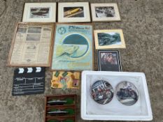 A selection of motoring collectables including prints, wall hanging plates depicting motorcycles
