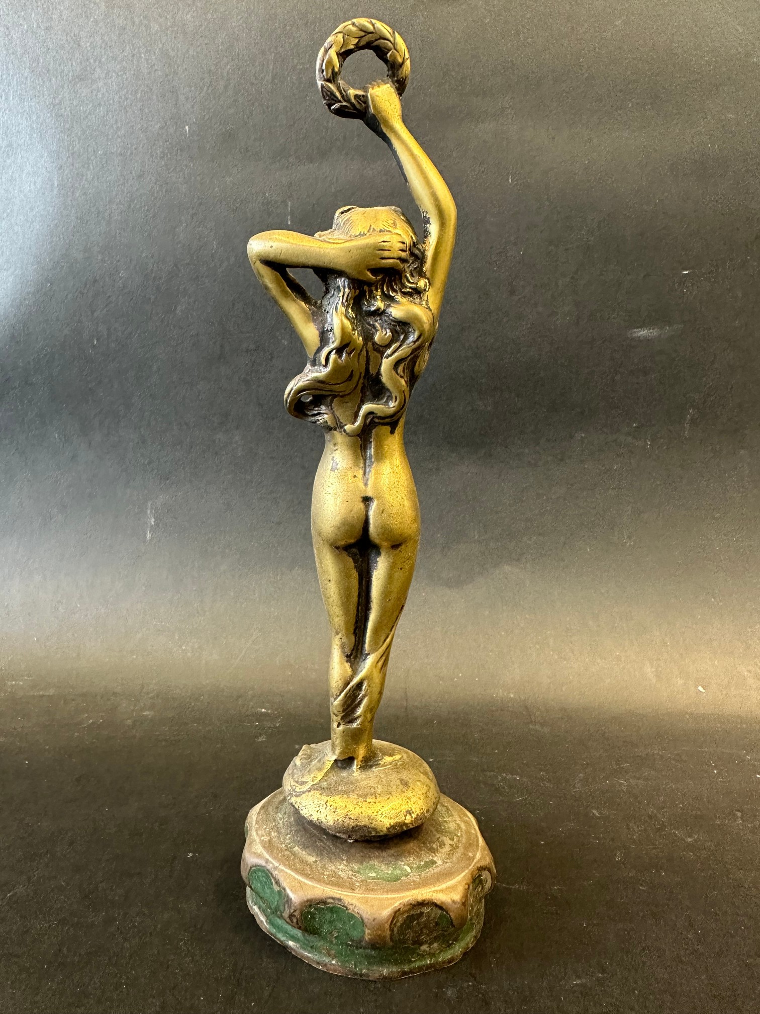 A brass car accessory mascot in the form of a lady holding a laurel wreath aloft, radiator cap - Image 3 of 3