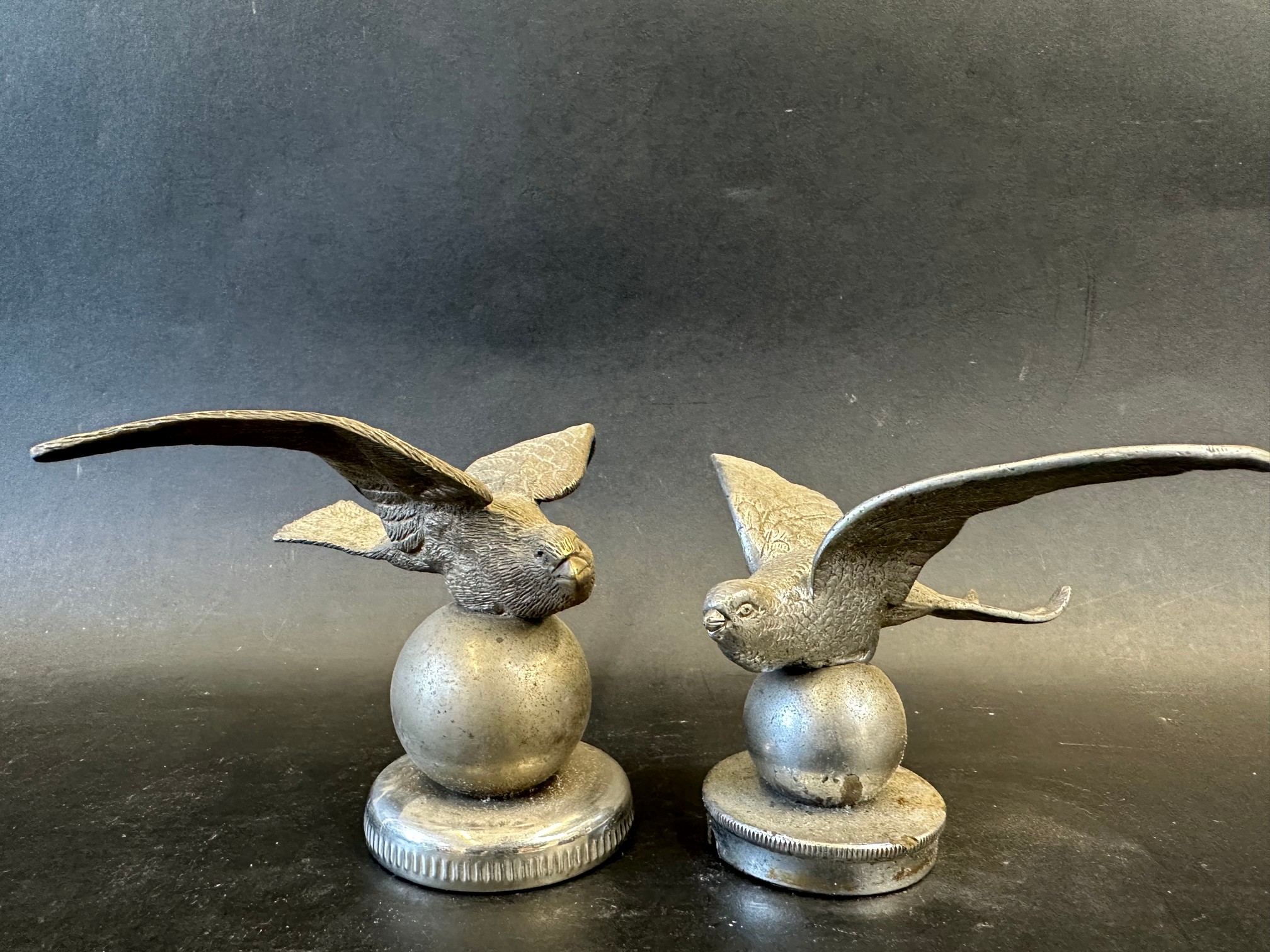 Two similar car mascots depicting a swallow or swift bird on a sphere, the smaller radiator cap - Image 2 of 2