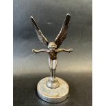 A car mascot in the form of a winged nude female, display base mounted, approx. 6 1/2" tall.