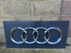 A large Audi advertising sign, 47 x 22".
