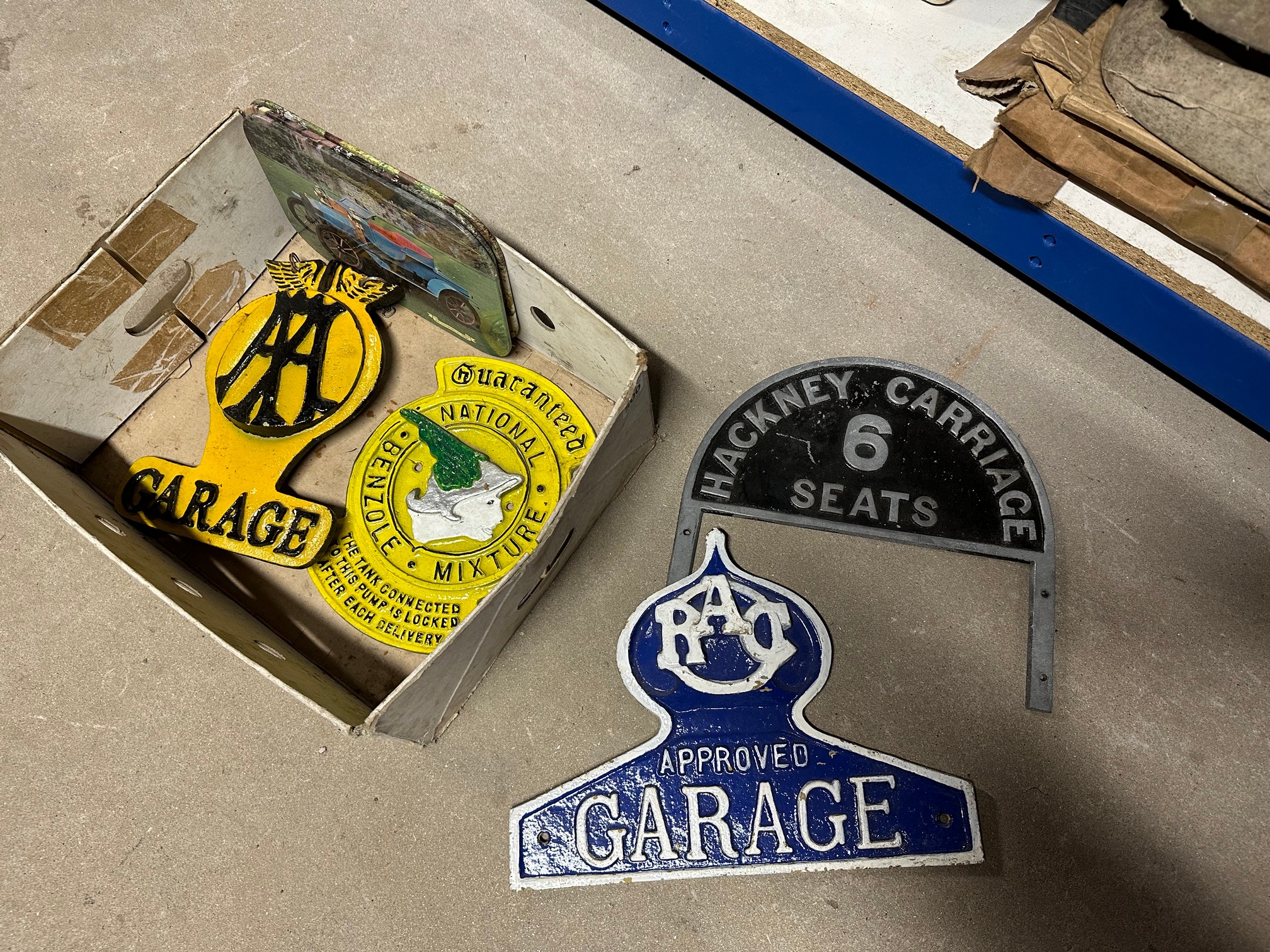 A selection of reproduction petrol pump brand indicator and other plaques etc.