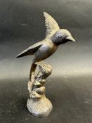 A car accessory mascot in the form of a bird perched on a branch, approx. 7" high.