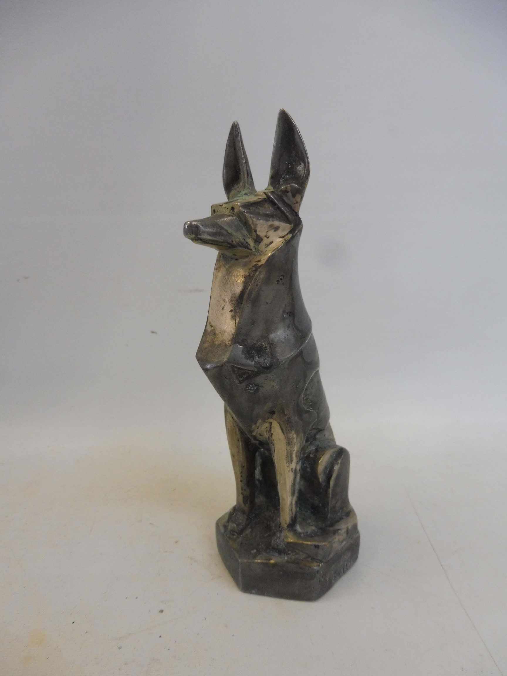 Jacques Cartier sitting alsatian car mascot, as photographed and described in Michael Legrand's book