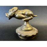 A car mascot in the form of a chasing dog, possibly Bonzo, radiator cap mounted, approx. 3 1/2"