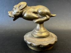 A car mascot in the form of a chasing dog, possibly Bonzo, radiator cap mounted, approx. 3 1/2"