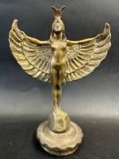 An brass car accessory mascot in the form of an Egyptian winged female, radiator cap mounted,