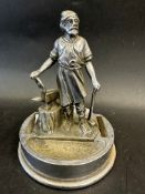 A Vulcan accessory mascot in the form of a blacksmith, mounted on an ashtray base, approx. 5 1/4"