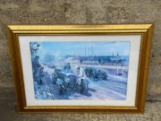 A large gilt framed and glazed print of Bentleys racing by Terence Cuneo.