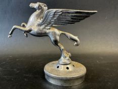 A Mobil Oil winged horse/Pegasus car mascot, display base mounted, approx. 4 1/2" tall overall.