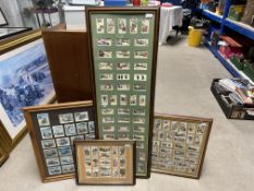 A quantity of framed and glazed cigarette cards on a motoring theme.