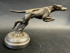 An AC Cars car accessory mascot in the form of a racing greyhound, display base mounted, approx. 3