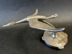 A car accessory mascot in the form of a slender flying stork, radiator cap mounted, approx. 4"