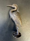 A car accessory mascot in the form of a heron or stork, approx. 5".