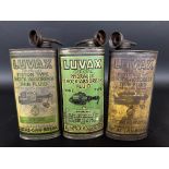 Three Luvax oval cans for shock absorber fluid.