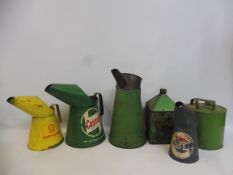 A selection of oil measures including Regent, a one gallon pyramid can etc.