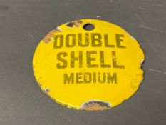 A small circular enamel brand tag for Double Shell Medium, 2 3/4" diameter.