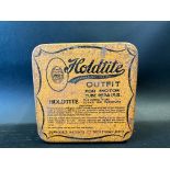 A Holdtite puncture repair outfit tin.