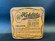 A Holdtite puncture repair outfit tin.