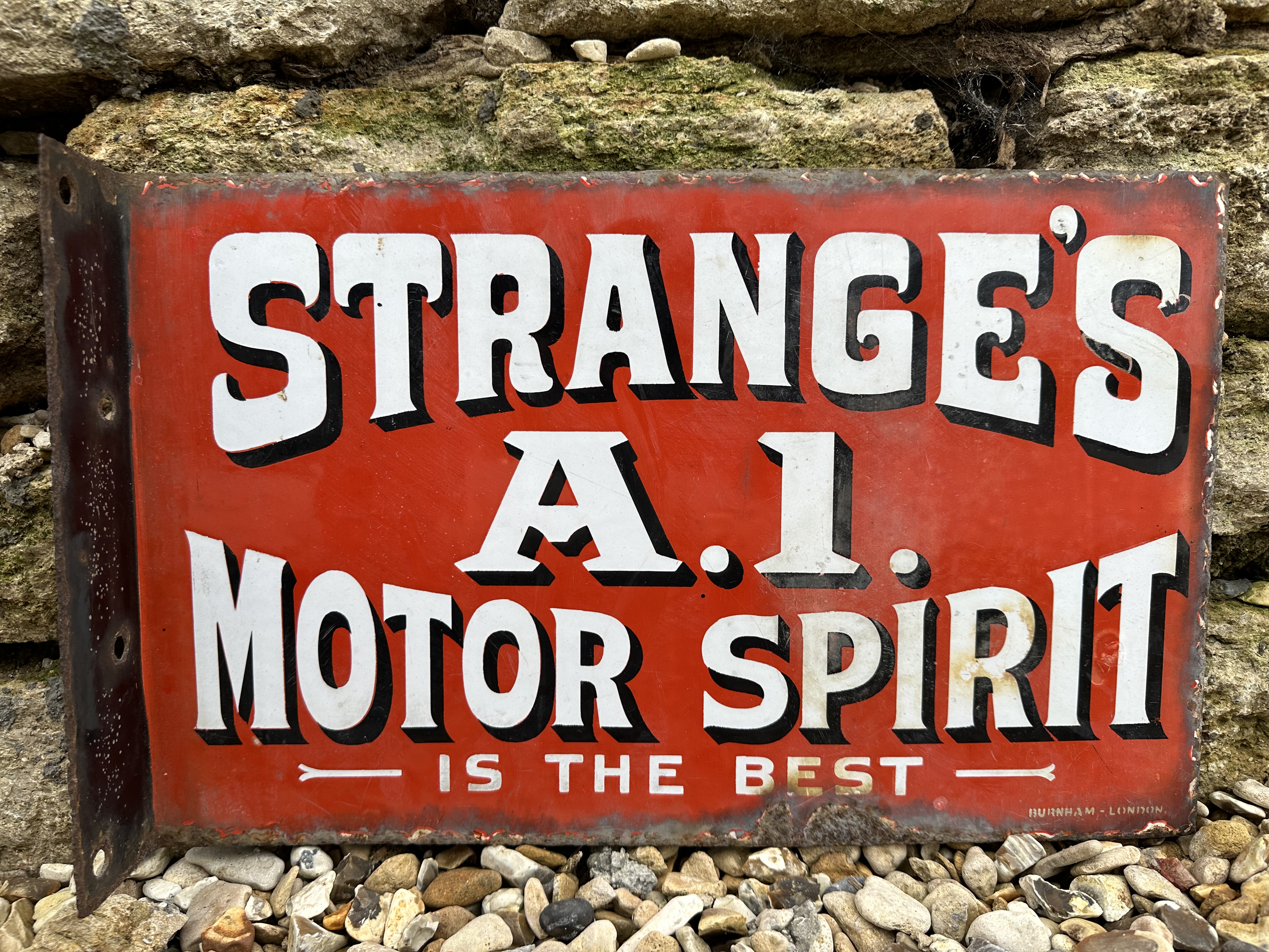 A rare Strange's A1 Motor Spirit 'Is the Best' double sided enamel sign with hanging flange, by