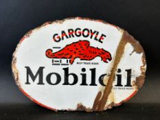 A small Gargoyle Mobiloil oval double sided enamel cabinet pediment, 11 x 8".