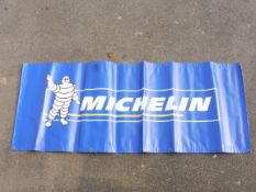 A contemporary Michelin banner, 77 1/2 x 29 1/2".