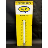 A Duckham's 20-50 Motor Oil enamel thermometer, lacking tube, 13 x 36".