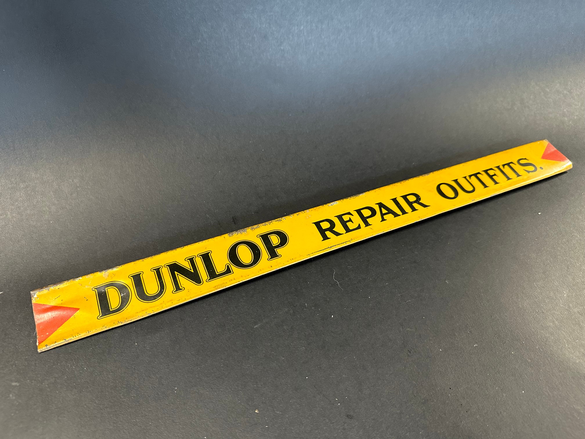 A Dunlop Repair Outfits shelf strip in good condition.