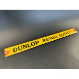 A Dunlop Repair Outfits shelf strip in good condition.