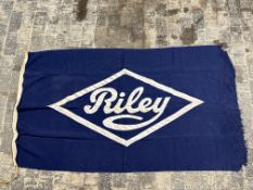 A large circa 1930s Riley showroom display flag, 71 x 41 1/2".