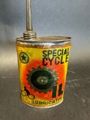 A Special Cycle Lubricating Oil oval tin with paper label.