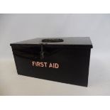 A First Aid rectangular tin with integral compartments.