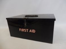 A First Aid rectangular tin with integral compartments.