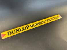 A Dunlop Rubber Solution shelf strip in good condition.