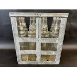 An Essolube crate of eight quart glass oil bottles.