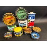 A collection of assorted car polish and other tins.