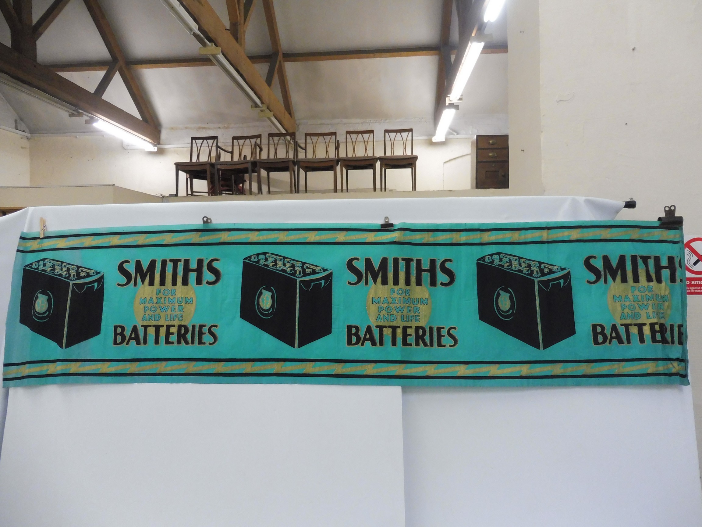 A rare surviving Smiths Battery crepe paper advertisement.