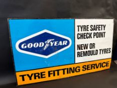 A Goodyear Tyre Fitting Service tin advertising sign, 35 x 20".