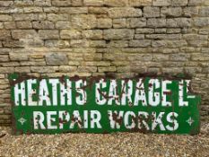 A large enamel sign advertising Heaths Garage 108 x 36".