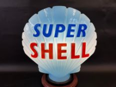 A blue Super Shell glass petrol pump globe by Hailware, excellent bright letters but repaired chip