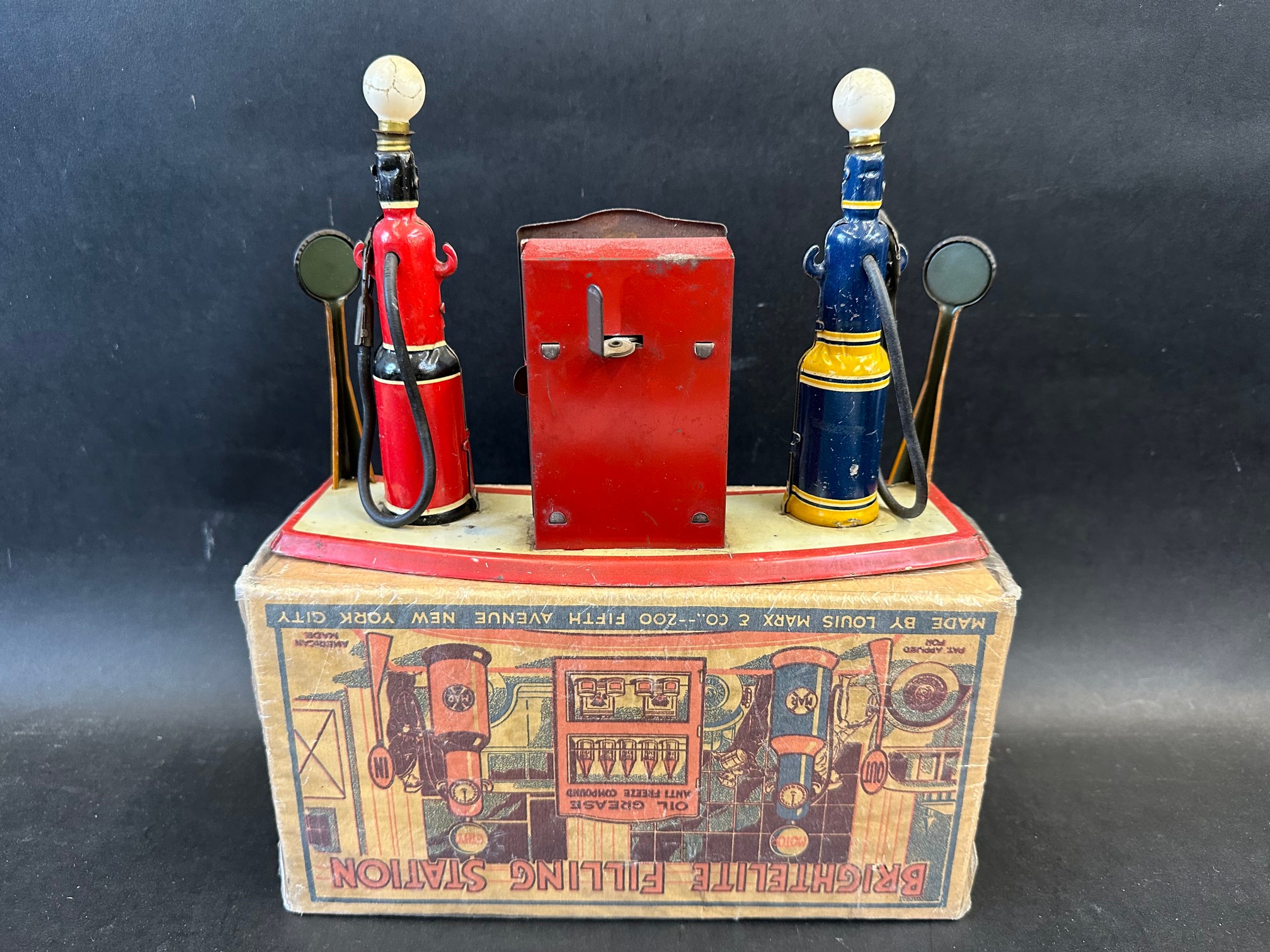 A rare boxed circa 1930s Marx Toys tinplate garage forecourt comprising two petrol pumps flanking - Image 4 of 4
